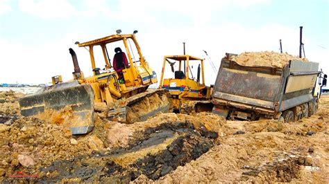 mini excavator stuck|bulldozer stuck in mud videos.